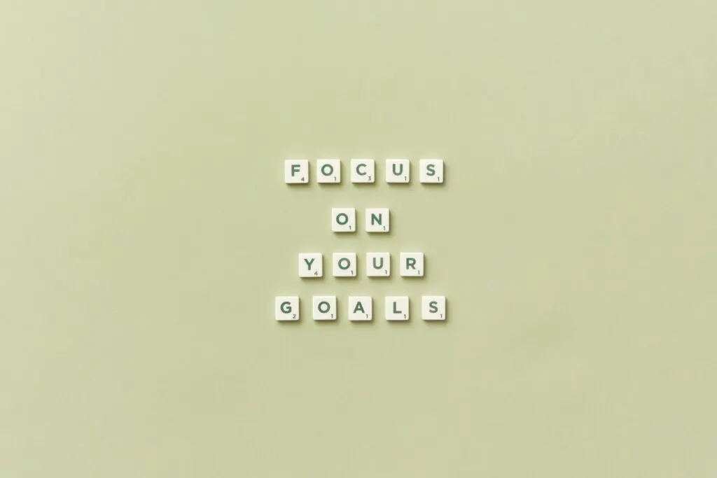 Scrabble tiles spelling out focus on your goals