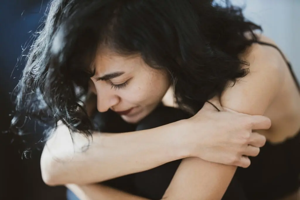 Woman curled up in pain